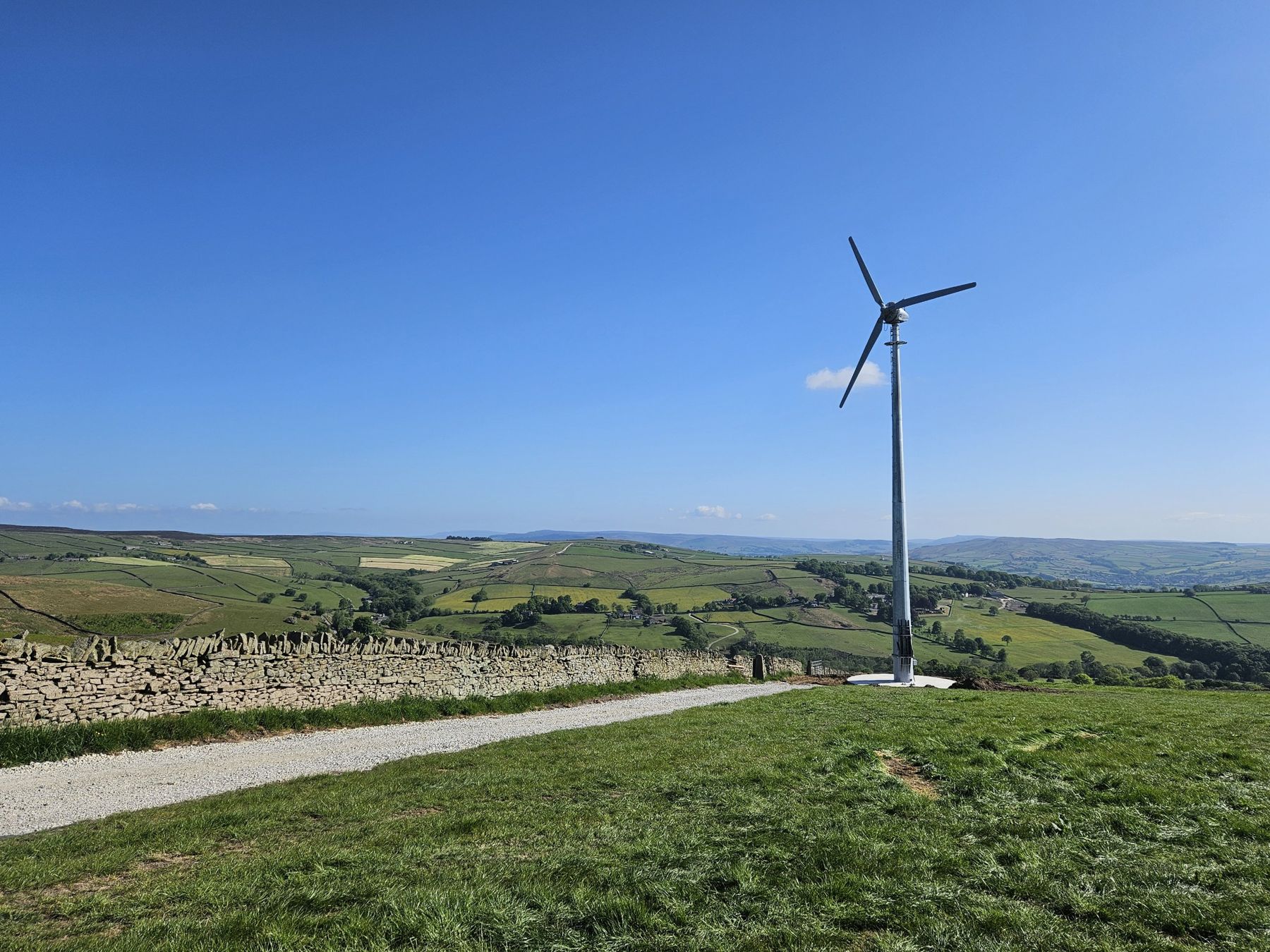 Kodair KW30 wind turbine on a hillside farm