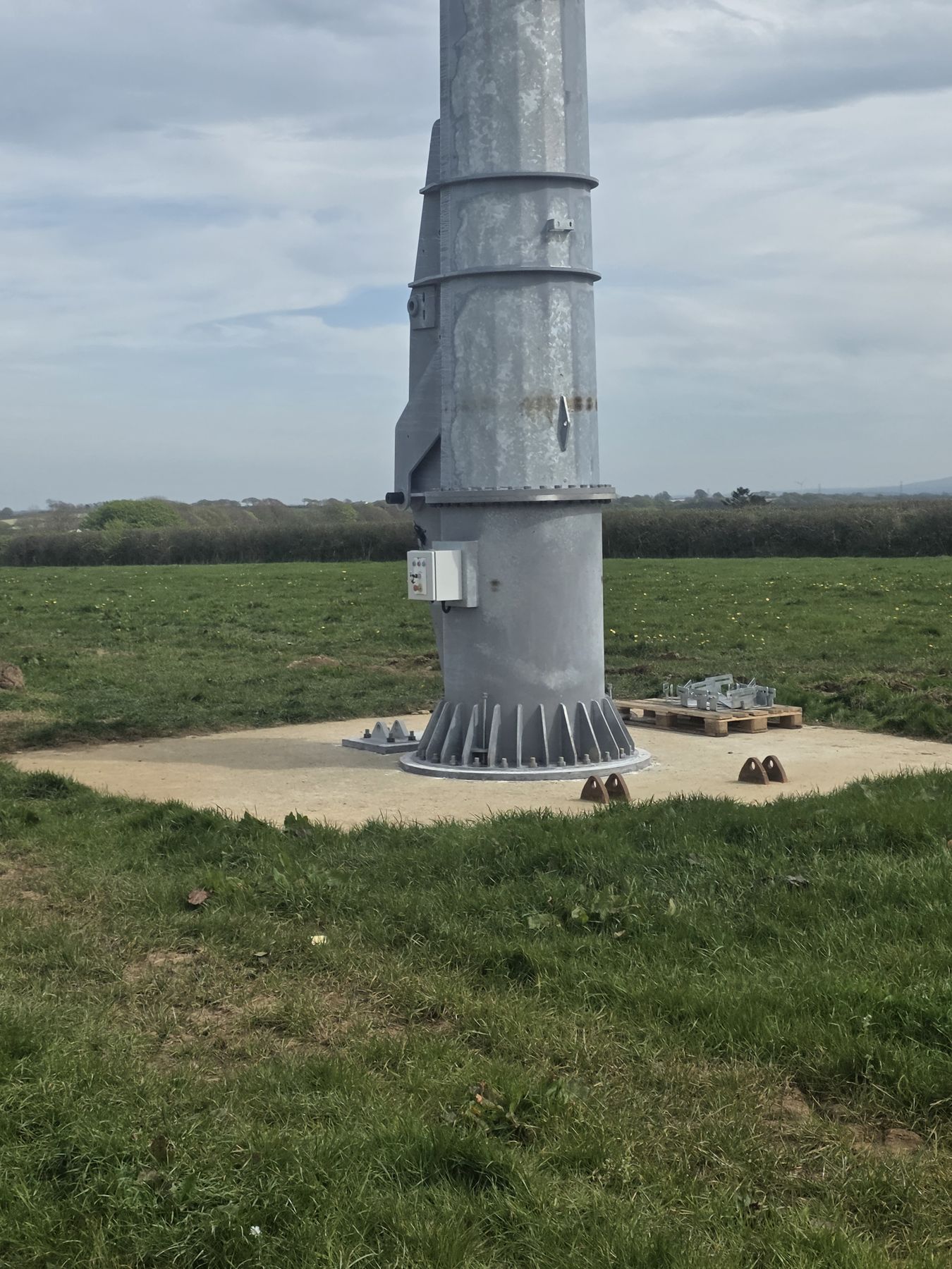 Kodair tower base bolted to a new concrete foundation